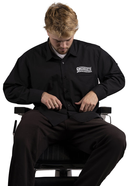 The lightweight premium work shirt is a popular selection for barbers and tattooists who need to have their sleeves rolled up and fastened securely, Made in the UK. Premium wholesale products.
